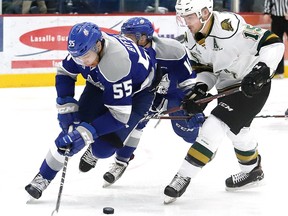Quinton Byfield, left, of the Sudbury Wolves, breaks away from Cole Tymkin of the London Knights, during OHL action in Sudbury, Ont. on January 18, 2019. (Postmedia file photo)