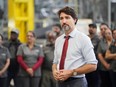Canada's Prime Minister Justin Trudeau takes questions from the media as he visits auto parts company ABC Technologies to talk about the USMCA trade agreement, in Brampton, Ontario, Canada January 30, 2020.