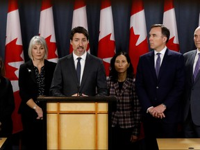 Canada's Prime Minister Justin Trudeau, with Deputy Prime Minister Chrystia Freeland (L), Minister of Health Patty Hajdu, Chief Public Health Officer Dr. Theresa Tam, Minister of Finance Bill Morneau, and Treasury Board President Jean-Yves Duclos (R), attends a news conference in Ottawa, Ontario, Canada March 11, 2020.