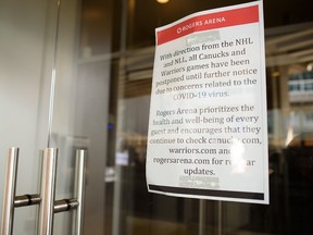 A notice posted on arena doors informs the public that NHL and NLL games at Rogers Arena are postponed until further notice. A game between the Winnipeg Jets at Vancouver Canucks has been cancelled following a decision by the NHL to postpone its season due to the Covid-19 coronavirus outbreak.
