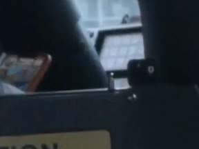 A driver is filmed playing a mobile phone game while behind the wheel of a TTC bus. BLOGTO