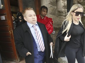 Marcella Zoia aka Chair Girl leaves the Old City Hall courts with her lawyer Greg Leslie after pleading guilty to mischief endangering life and will re-appear to be sentenced on Jan. 14 / 2020 on Friday November 15, 2019. Jack Boland/Toronto Sun/Postmedia Network