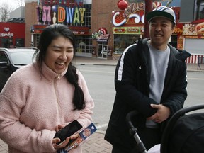 Chris and Sara on their first visit to Niagara Falls walking with their three children along Clifton Hill's empty streets and closed shops and attactions on Thursday, March 19, 2020. (Veronica Henri/Toronto Sun/Postmedia Network)
