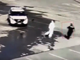 In a video still, York Regional Police Const. Andrew Varao can be seen being confronted by Chidubem Anthony Okeke in the parking lot at Hillcrest Mall in Richmond Hill, Ont., on Friday. (Screengrab)