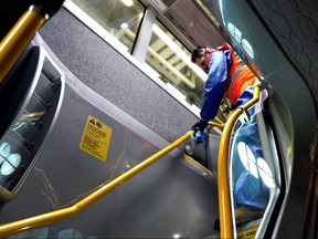 A worker used Aegis Microbe Shield Antimicrobial Spray on GO Transit. (SUPPLIED/METROLINX)