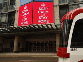 A streetcar passes the Princess of Wales Theatre in Toronto on Saturday March 28, 2020.
