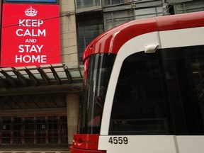 A streetcar passes the Princess of Wales Theatre in Toronto on Saturday, March 28, 2020.