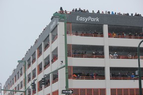 Fans line a multi-level parking garage in downtown Anchorage during the ceremonial start of the Iditarod Trail Sled Dog Race. (IAN SHANTZ/TORONTO SUN)