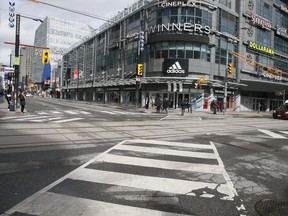 A few stay active on the empty streets of Toronto on Friday, March 20, 2020. (Veronica Henri/Toronto Sun)