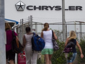 Workers arrive for their shift at the Chrysler (FCA) assembly Plant in Windsor on June 12, 2018.