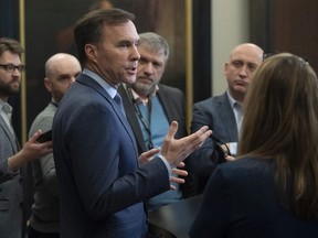 Minister of Finance Bill Morneau speaks with the media in the foyer of the House of Commons in Ottawa, Monday March 9, 2020.