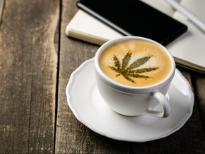 Cannabis coffee - marijuana leaf on coffee foam
