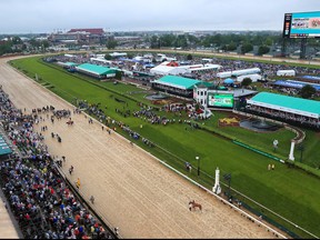 A general view of Maximum Security and Country House both being hotwalked while awaiting the outcome of a protest after the 145th running of the Kentucky Derby at Churchill Downs on May 4, 2019 in Louisville, Kentucky.