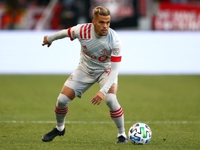 Auro Jr., of Toronto FC dribbles the ball during the first half of an MLS game against New York City FC at BMO Field on March 07, 2020 in Toronto, Canada.  (Photo by Vaughn Ridley/Getty Images)