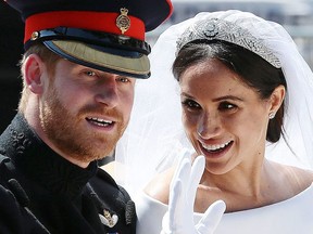 Britain's Prince Harry, Duke of Sussex and his wife Meghan, Duchess of Sussex wave from the Ascot Landau Carriage during their carriage procession on the Long Walk as they head back towards Windsor Castle in Windsor, on May 19, 2018 after their wedding ceremony. (Photo by Aaron Chown / POOL / AFP)        (Photo credit should read AARON CHOWN/AFP via Getty Images)