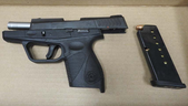 Shea Darrell, 30, of Toronto, faces a dozen charges for allegedly fleeing from cops and ditching this handgun in Pickering on Friday, March 6, 2020. (Durham Regional Police)