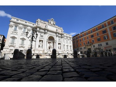 An empty Di Trevi fountain is pictured as Italy tightens measures to try and contain the spread of coronavirus disease (COVID-19), in Rome, Italy March 24, 2020.