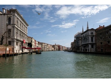 The Grand Canal is empty after Italy tightened the lockdown measures to combat the coronavirus disease (COVID-19) outbreak in Venice, Italy, March 22, 2020.