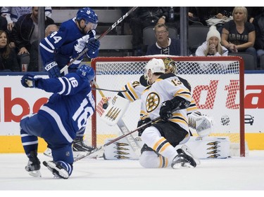 Toronto Maple Leafs center Mitchell Marner (16) scores the winning goal during the overtime period against the Boston Bruins at Scotiabank Arena.