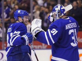 Toronto Maple Leafs defenseman Morgan Rielly and goaltender Frederik Andersen celebrate after defeating the Tampa Bay Lightning at Scotiabank Arena.