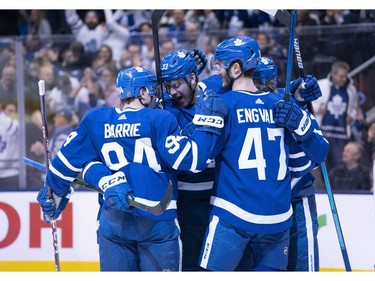 Toronto Maple Leafs center Frederik Gauthier (33) celebrates a goal with Toronto Maple Leafs defenseman Tyson Barrie (94) during the first period against the Vancouver Canucks at Scotiabank Arena.