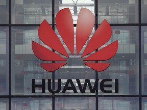 In this file photo taken on April 29, 2019, the Huawei logo and signage is seen at their main U.K. offices in Reading, west of London.