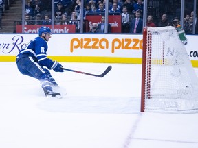 Maple Leafs winger Zach Hyman scores an empty-net goal against the Vancouver Canucks on Saturday at Scotiabank Arena. (Nick Turchiaro/USA TODAY Sports)