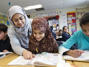 Teacher Aisha Jamal with students at the Islamic Foundation School in Durham on Wednesday, March 11, 2020. (Stan Behal/Toronto Sun/Postmedia Network)