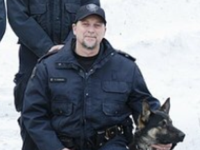 Toronto Police Const. Brian Andrews with his partner Jango, who tracked down four suspects following a series of armed robberies on Friday, March 6, 2020. (supplied photo)