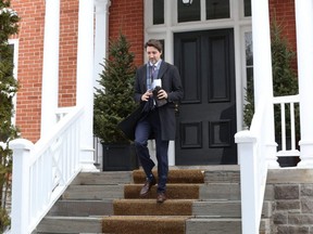 Prime Minister Justin Trudeau exit his residence in Ottawa to attend a news conference on the COVID-19 situation, Tuesday, March 24, 2020.