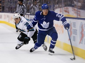 Maple Leafs forward Kasperi Kapanen (front) gets past San Jose Sharks defenceman Mario Ferraro earlier this season. The two teams play Tuesday night. (John E. Sokolowski/USA TODAY Sports)