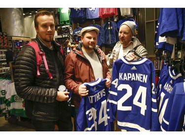 Inside the Scotiabank Arena it was supposed to be game day until the NHL suspended operations - along with other leagues - as the Covid-19 Coronavirus pandemic takes hold throughout the world. (Pictured, L-R) These three fans from Finland have seen games in Chicago, Detroit and were hoping to see the Maple Leafs. Mikael Pesonen (L), Mikko Haavisto, Jarno Tolonen checking out their homeland's jersey of Kasperi Kapenen in Toronto on Thursday March 12, 2020. Jack Boland/Toronto Sun/Postmedia Network