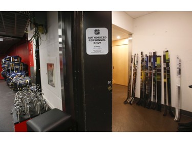 Inside the Scotiabank Arena it was supposed to be game day until the NHL suspended operations - along with other leagues - as the Covid-19 Coronavirus pandemic takes hold throughout the world. (Pictured) The visitor's dressing room - with the Nashville Predators sticks and equipment in the hallway  - that is home to both NHL and NBA teams in Toronto on Thursday March 12, 2020. Jack Boland/Toronto Sun/Postmedia Network