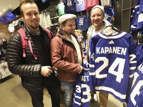 Inside the Scotiabank Arena it was supposed to be game day until the NHL suspended operations - along with other leagues - as the Covid-19 Coronavirus pandemic takes hold throughout the world. (Pictured, L-R) These three fans from Finland have seen games in Chicago, Detroit and were hoping to see the Maple Leafs. Mikael Pesonen (L), Mikko Haavisto, Jarno Tolonen checking out their homeland's jersey of Kasperi Kapenen in Toronto on Thursday March 12, 2020.