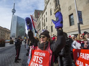 Ontario teachers and education workers picket outside of The Fairmont Royal York Hotel in Toronto, Ont. on Wednesday February 12, 2020.