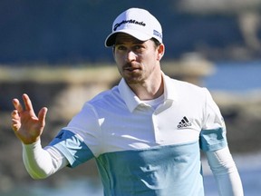 Nick Taylor acknowledges the crowd on the 18th hole during the second round of the AT&T Pebble Beach Pro-Am golf tournament at Pebble Beach Golf Links in Pebble Beach, Calif., on Feb. 7, 2020.
