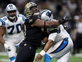 David Onyemata of the New Orleans Saints tackles Cam Newton of the Carolina Panthers at the Mercedes-Benz Superdome on January 7, 2018 in New Orleans. (Chris Graythen/Getty Images)