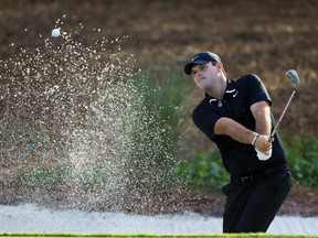 Patrick Reed plays a shot from a bunker during a practice round prior to The PLAYERS Championship on The Stadium Course at TPC Sawgrass in Ponte Vedra Beach, Fla., on Wednesday, March 11, 2020.