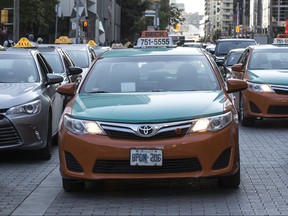 Taxi cabs outside Union Station on Monday August 8, 2016. Craig Robertson/Toronto Sun/Postmedia Network