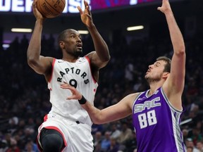 Toronto Raptors centre Serge Ibaka shoots over Kings forward Nemanja Bjelica at Golden 1 Center. USA TODAY