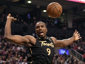 Serge Ibaka of the Raptors shows off his muscular upper body reacts after dunking against the Phoenix Suns on Feb. 21, 2020, at Scotiabank Arena. 
(DAN HAMILTON/USA Today Sports)