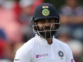 India’s Virat Kohli was on the losing side in Test matches against New Zealand, and then lost his temper with fans, opponents, and a journalist. (MARTIN HUNTER/Reuters)