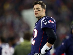 FOXBOROUGH, MASSACHUSETTS - JANUARY 04: Tom Brady #12 of the New England Patriots looks on from the sideline during the the AFC Wild Card Playoff game against the Tennessee Titans at Gillette Stadium on January 04, 2020 in Foxborough, Massachusetts. (Photo by Maddie Meyer/Getty Images)