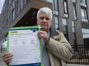 Tom Robson, a resident of TCHC housing on King St. E. who says it took three days for TCHC to give him approval to post warnings about Covid-19, is seen here on Friday, March 20, 2020. (Stan Behal/Toronto Sun/Postmedia Network)