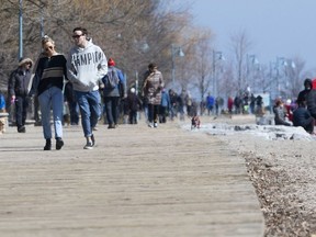 Torontonians enjoy a Friday afternoon in The Beach despite government calls for social distancing.  Friday, March 27, 2020. (Stan Behal/Toronto Sun/Postmedia Network)