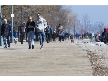 Torontonians enjoy a Friday afternoon in The Beach despite government calls for social distancing.  Friday March 27, 2020. Stan Behal/Toronto Sun/Postmedia Network