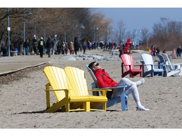 Torontonians enjoy a Friday afternoon in The Beach despite government calls for social distancing.  Friday March 27, 2020. Stan Behal/Toronto Sun/Postmedia Network