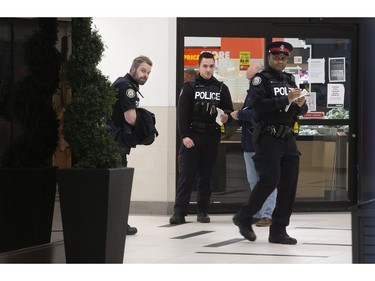 As Torontonians adjust to life during the Covid-19 pandemic; Toronto Police continue to respond to calls, this one at 345 Bloor Street East,  on Sunday March 29, 2020. Stan Behal/Toronto Sun/Postmedia Network
