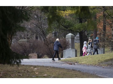 As Torontonians adjust to life during the Covid-19 pandemic;  a family gets some fresh air in Mount Pleasant Cemetery, on Sunday March 29, 2020. Stan Behal/Toronto Sun/Postmedia Network
