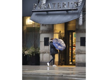 As Torontonians adjust to life during the Covid-19 pandemic;  a Pusateri's customer arrives at their Bay Street store in Yorkville. Pusateri's was slammed by Ontario Premier Doug Ford for gouging their customers with ridiculously high prices for much in demand disinfectant wipes and other essential products. Sunday March 29, 2020. Stan Behal/Toronto Sun/Postmedia Network